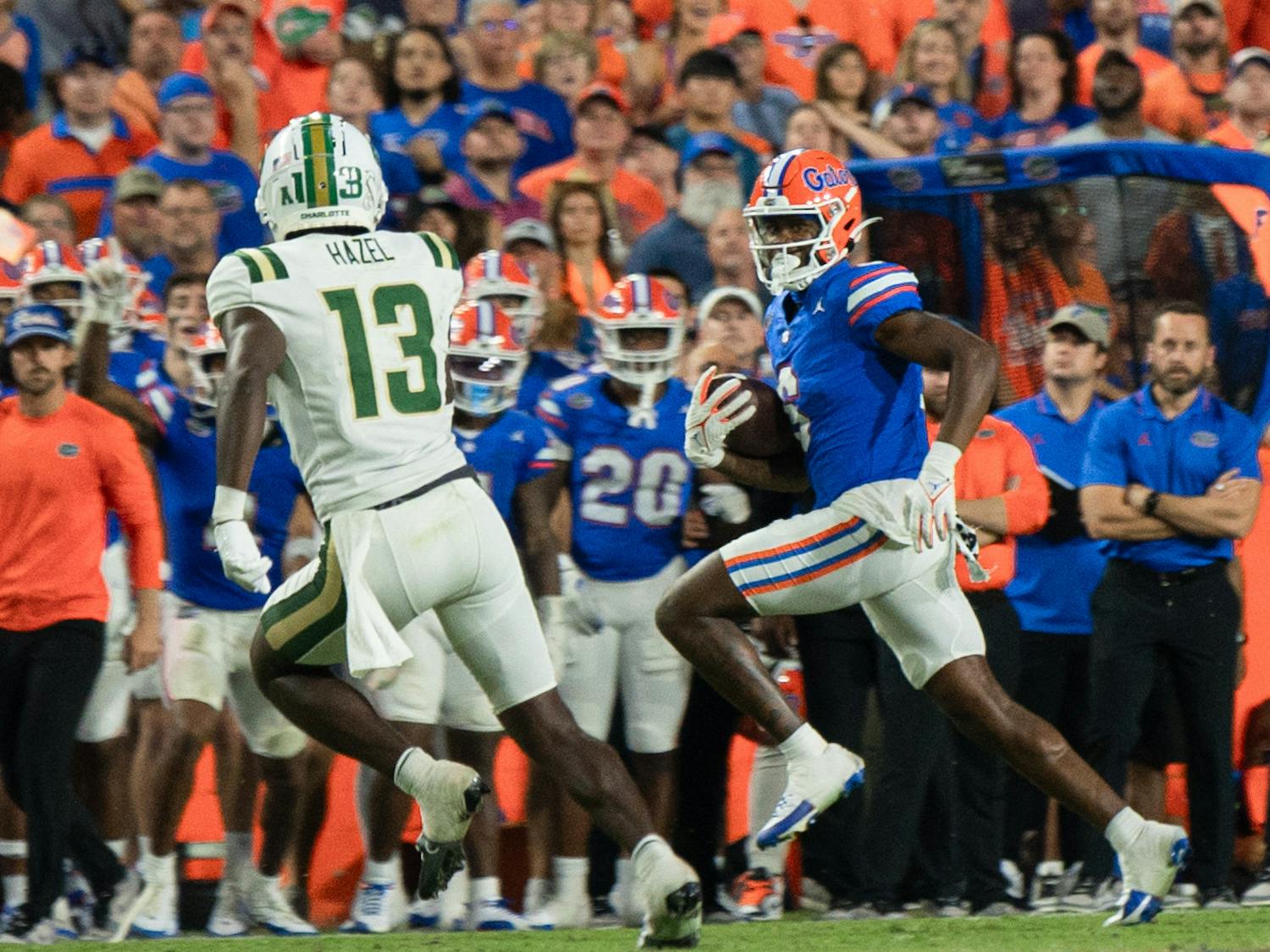 Freshman wide receiver Andy Jean runs the ball against a Charlotte defender in the Gators' 22-7 win against the Charlotte 49ers on Saturday, Sept. 23, 203.