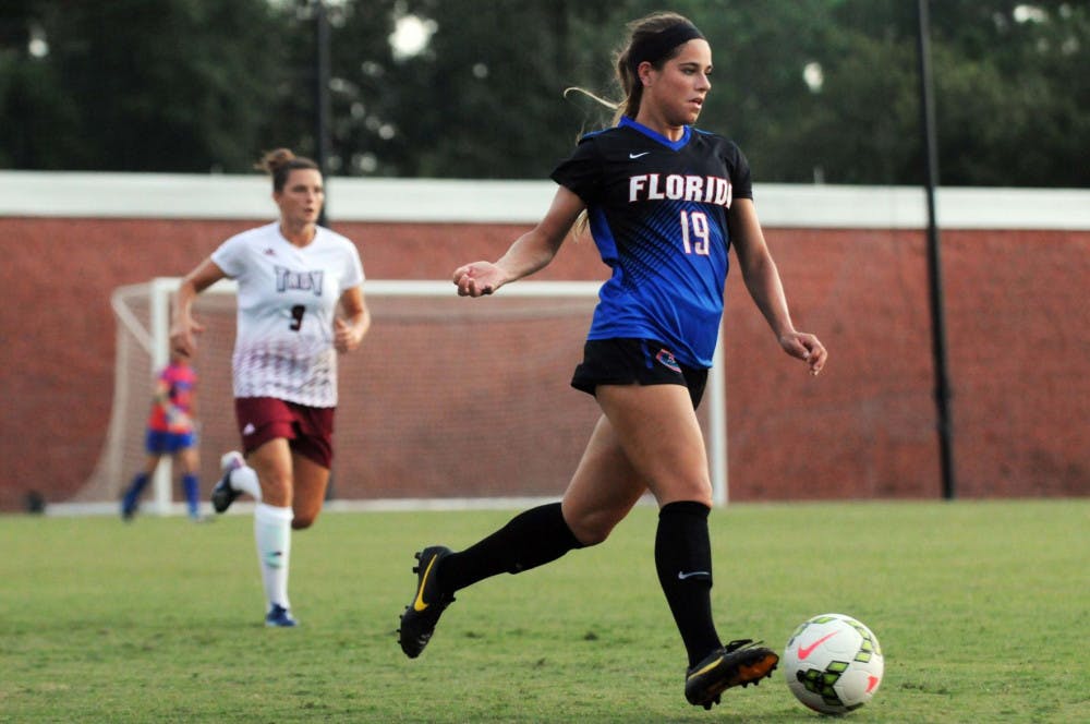 UF's Kristen Cardano dribbles during Florida's 2-1 win against Troy in an exhibition match on Aug. 11, 2015, at the soccer practice field at Donald R. Dizney Stadium.