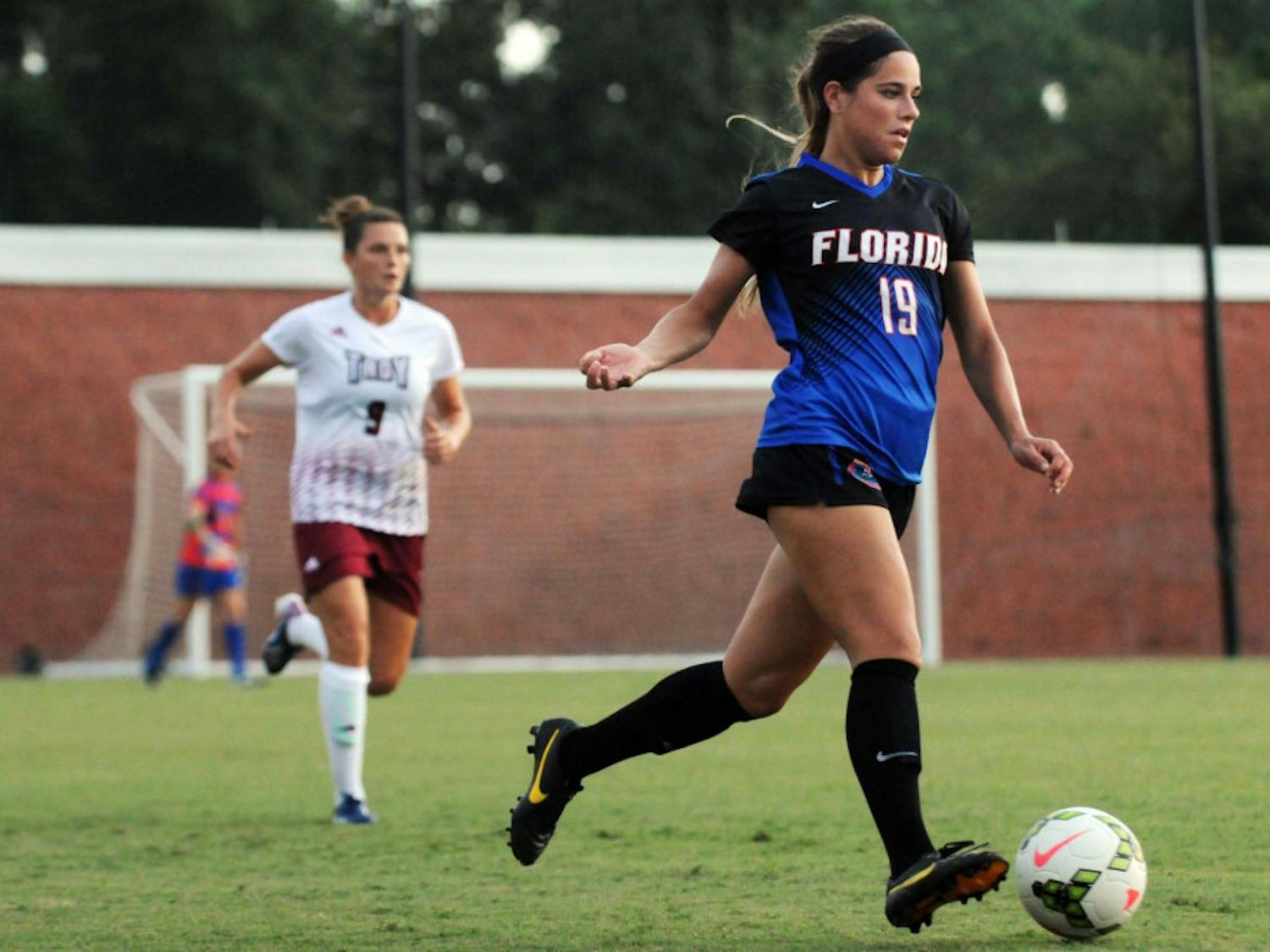 UF's Kristen Cardano dribbles during Florida's 2-1 win against Troy in an exhibition match on Aug. 11, 2015, at the soccer practice field at Donald R. Dizney Stadium.