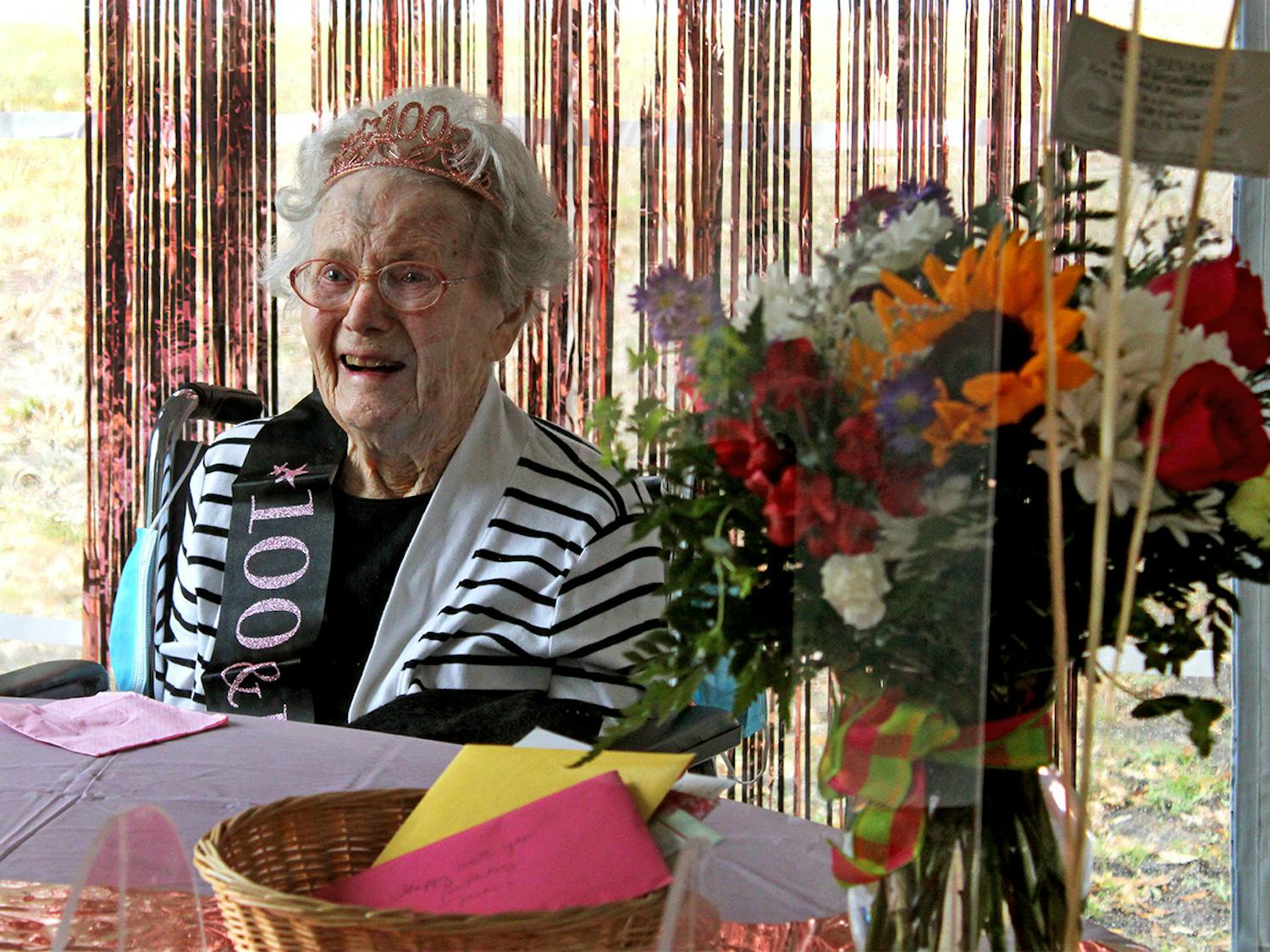Marion Broadaway smiles as she tells stories of her life to family members and reporters at her 100th birthday celebration on Friday, Feb. 5, 2021.
