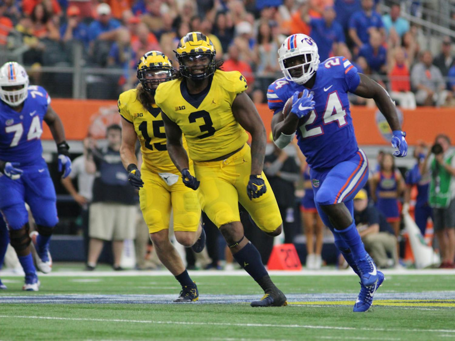 UF running back Mark Thompson runs for a touchdown only for it to be called back due to a penalty during Florida's 33-17 loss to Michigan on Saturday at AT&T Stadium in Arlington, Texas.