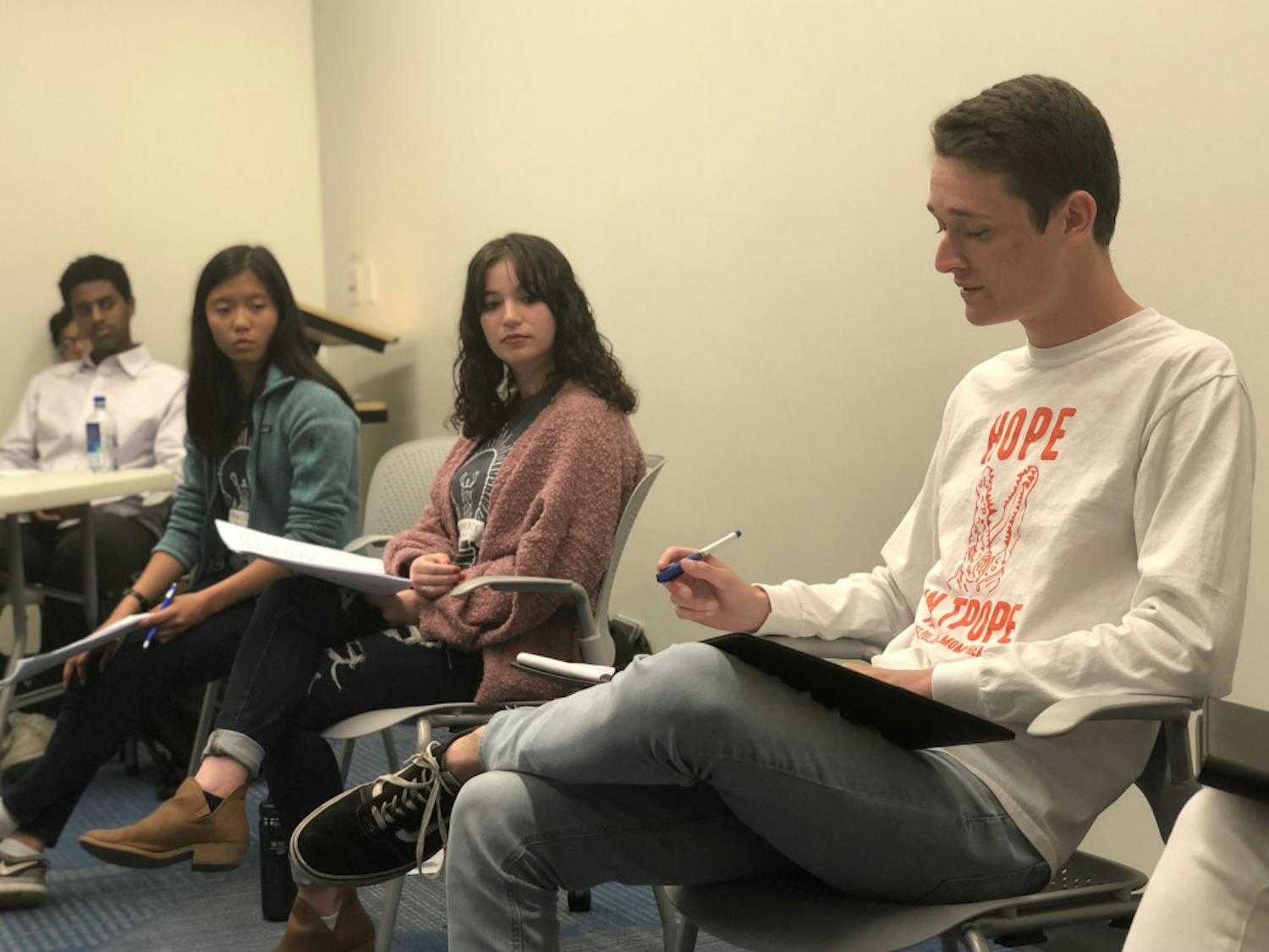 Candidates Emma Sanchez (left), Zoe Terner (middle) and Nick Meyer (right) deliver their closing remarks at a debate between Inspire and Gator parties‘ liberal arts and sciences candidates on Monday night.