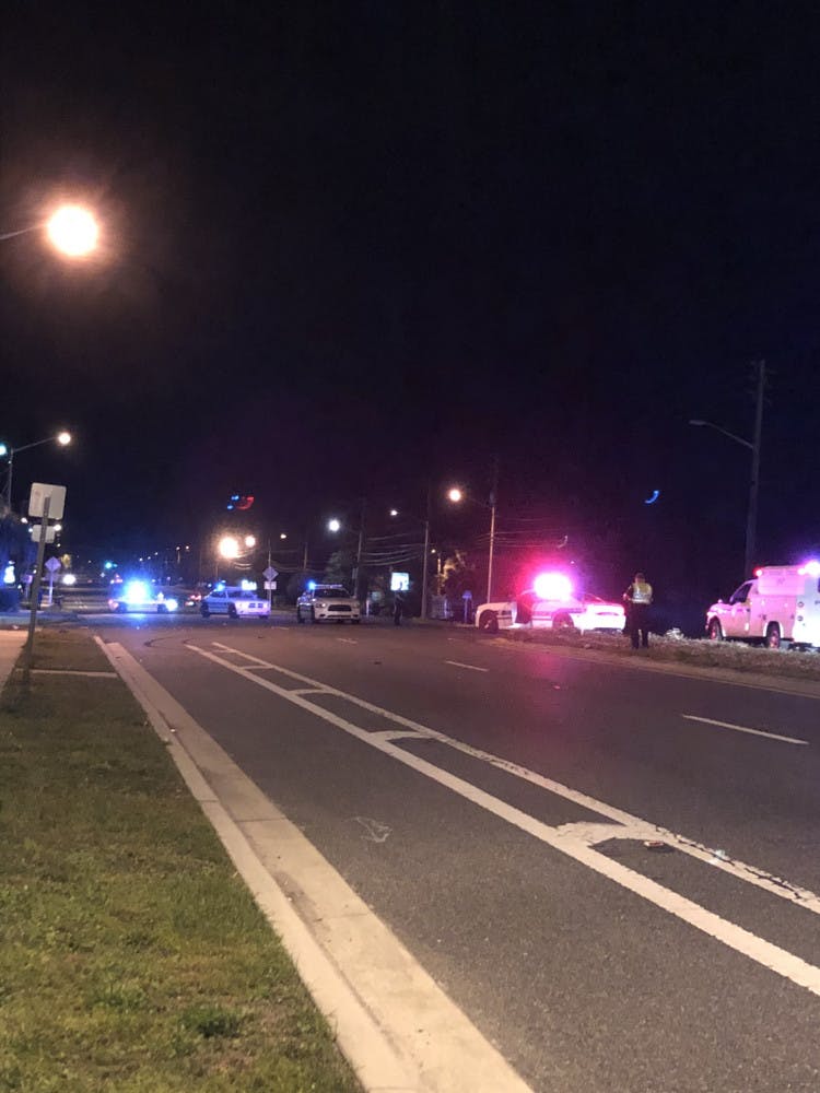 A woman died at UF Health Shands after she was hit by a car while crossing Southwest 13th Street, according to Gainesville Police.  