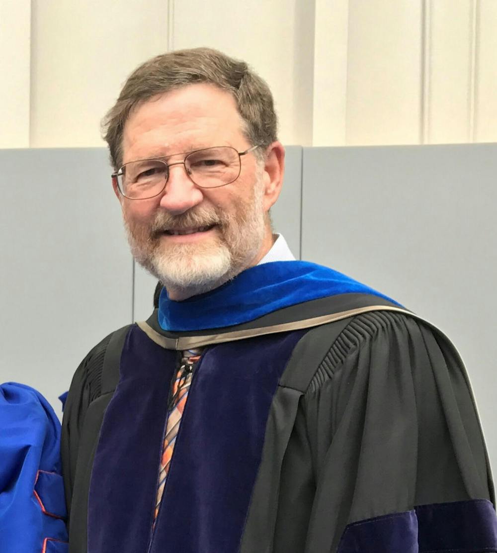 <p><span>Richard Yost, 66, pictured in April 2019 at a PhD commencement ceremony where he escorted his most recent PhD graduate student.</span></p>