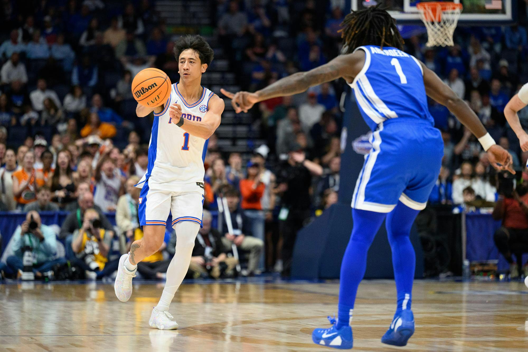 Florida guard Xaivian Lee (1) passes during the first half of an SEC Men's Basketball Tournament quarterfinal game against Kentucky, Friday, March 13, 2026, in Nashville, Tenn.