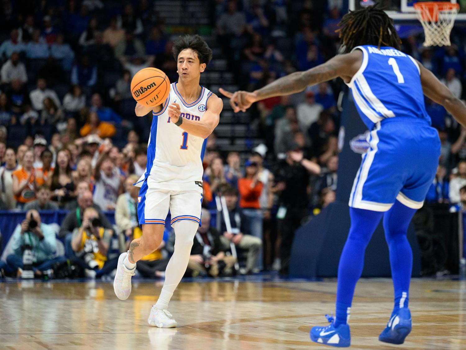 Florida guard Xaivian Lee (1) passes during the first half of an SEC Men's Basketball Tournament quarterfinal game against Kentucky, Friday, March 13, 2026, in Nashville, Tenn.