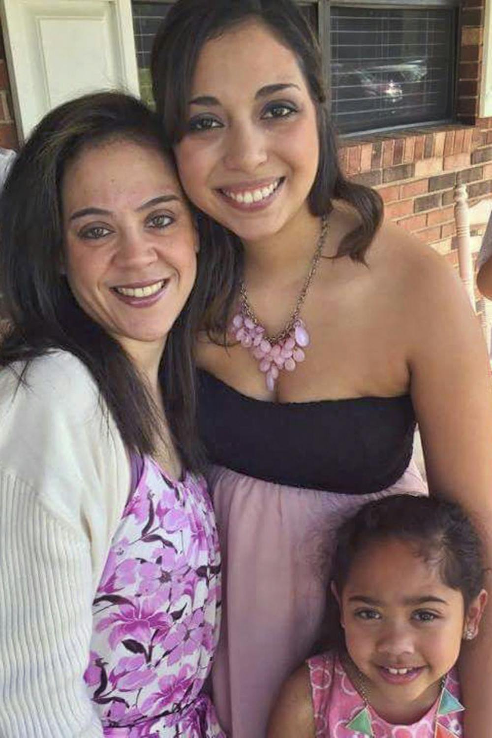 <p>Barbie Diaz, center, poses with her sister, Zuly, left, and her niece and goddaughter, 8-year-old Zophia.</p>