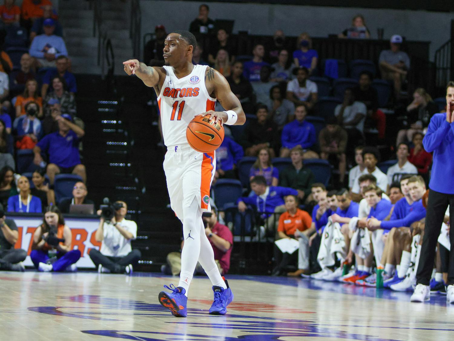 Graduate student guard Kyle Lofton directs the offense in Florida&#x27;s 81-45 victory over Stony Brook Monday, Nov. 7, 2022.