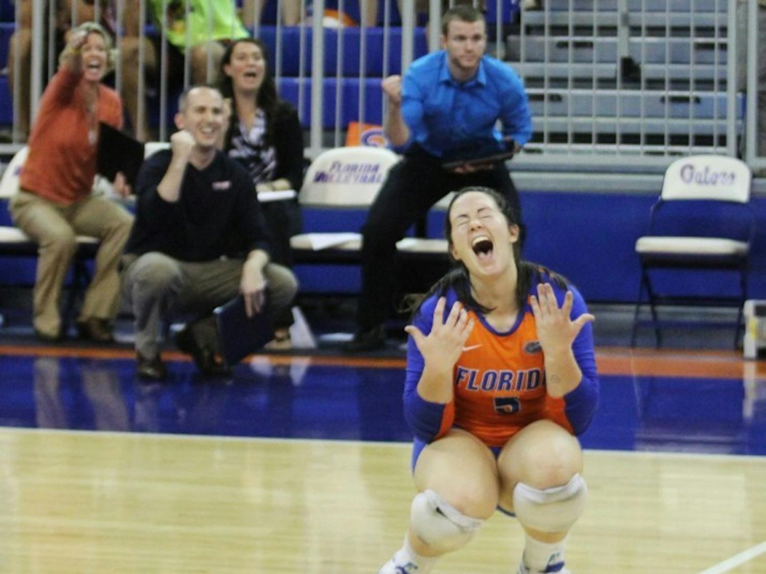 Libero Taylor Unroe celebrates after recording an ace in a 3-0 sweep of Missouri. The sophomore had 15 digs and 5 assists against the Tigers on Friday.