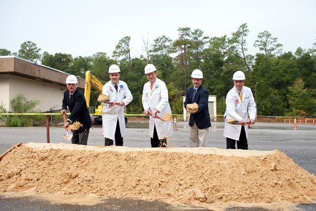 Tim Goldfarb, Shands Heatlhcare CEO; Michael Good, M.D., dean of the University of Florida College of Medicine; David Guzick, M.D., senior vice president for health affairs and president of the UF&amp;Shands Health System; Lee Pinkoson, Alachua County Commission Chair; and Marvin A. Dewar, M.D., J.D., CEO and chief medical office of University of Florida Physicians ceremonially toss dirt at the ground breaking ceremony for the UF&amp;Shands at Springhill campus.