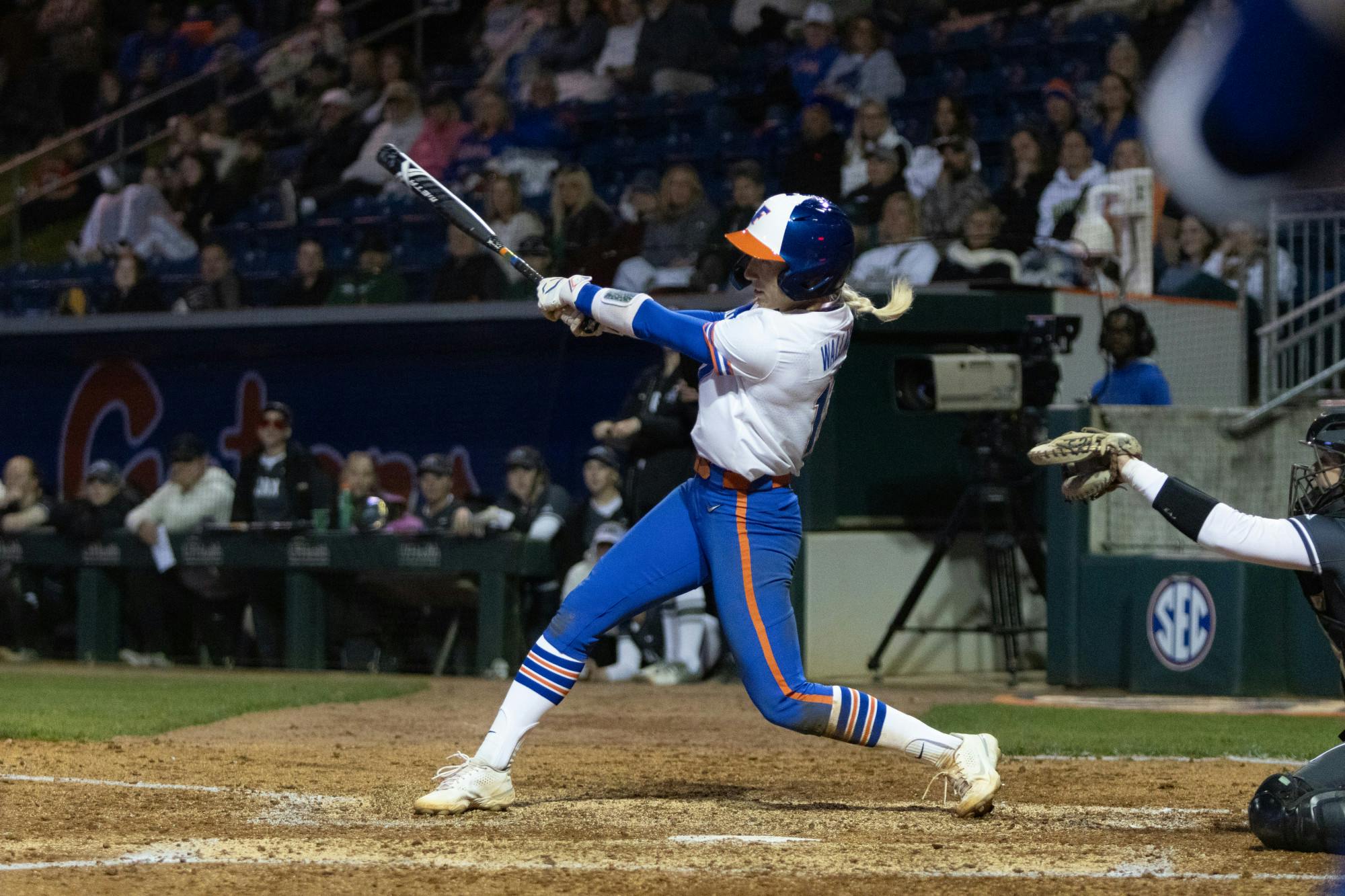 Gators softball redshirt senior Skylar Wallace follows through on a swing in Florida's win over Jacksonville University on Wednesday, February 14, 2024. 