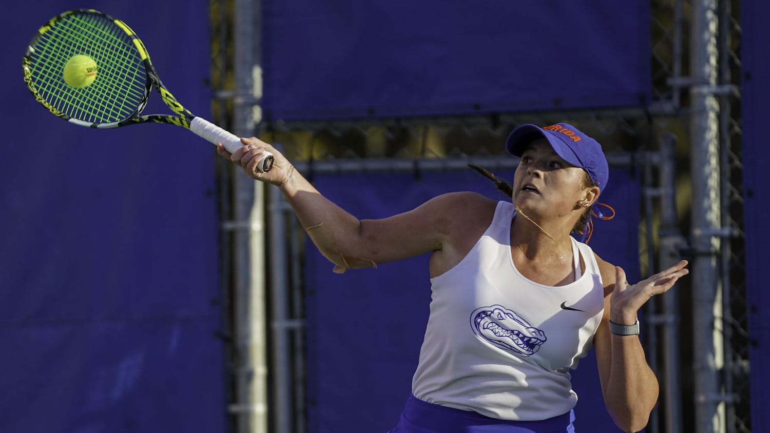 Reagan Parker catches the ball in her racket at Alfred A. Ring Tennis Complex on Friday, March 28, 2025. Jimena Gomez Alonso of University of Arkansas defeated Parker 6-3 and 6-0.