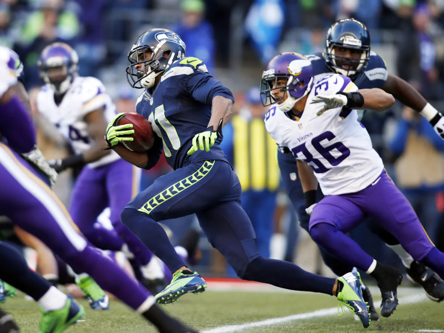 Seattle Seahawks' Percy Harvin (11) returns the ball against the Minnesota Vikings on a kickoff in the first half of his team's 41-20 win Sunday in Seattle.