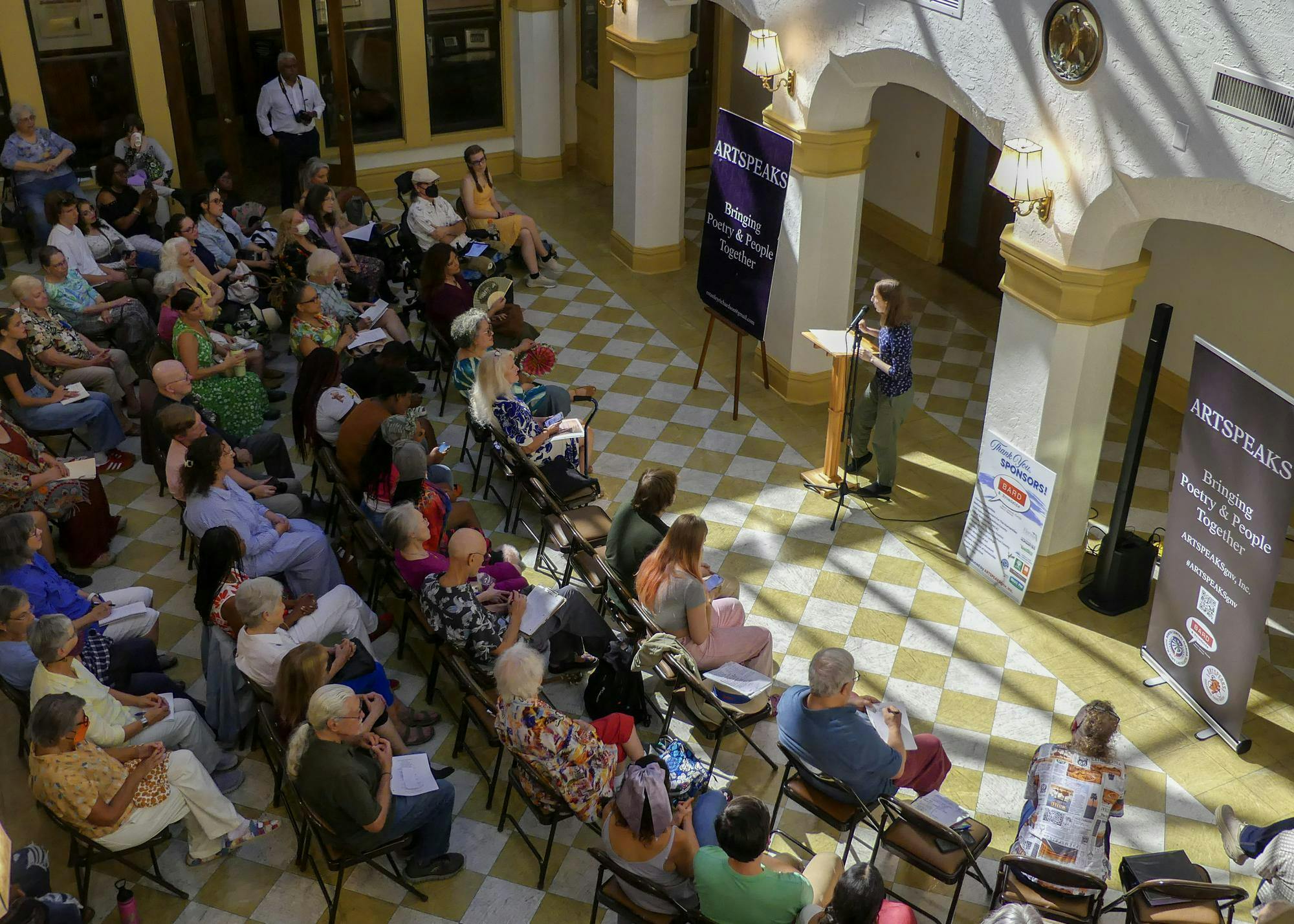 Audience members at the Thomas Center listen intently to the Artspeaks poems, occasionally snapping and humming in response, on Sept. 7, 2025.