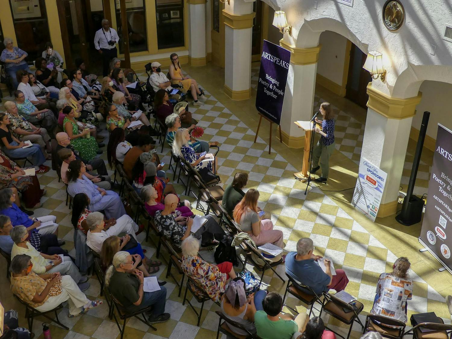 Audience members at the Thomas Center listen intently to the Artspeaks poems, occasionally snapping and humming in response, on Sept. 7, 2025.