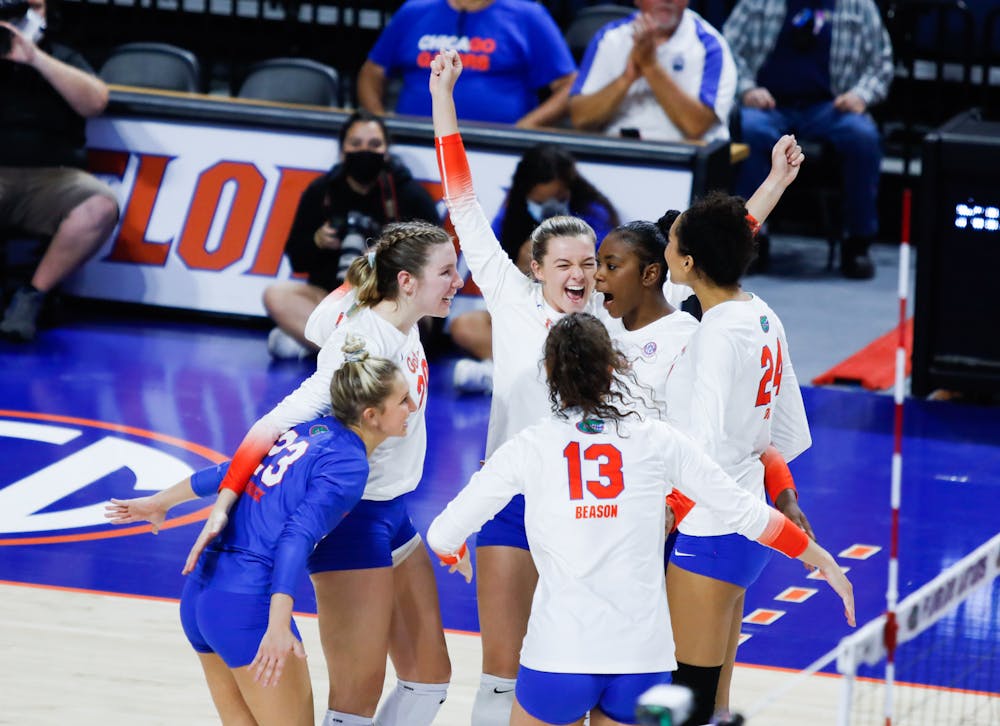 <p>Florida&#x27;s volleyball team celebrates during a match against Texas A&amp;M on Oct. 16, 2021. The Gators kicked off their 2022 season with a four-set win over North Florida Friday night. </p>