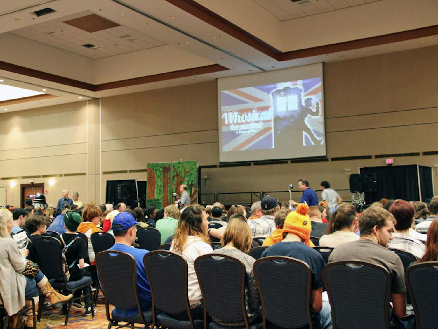 SwampCon participants wait for the start of “Whosical The Musical: A Game of Time,” a student-run musical show based on several TV series, in the Reitz Union Grand Ballroom Saturday night.
