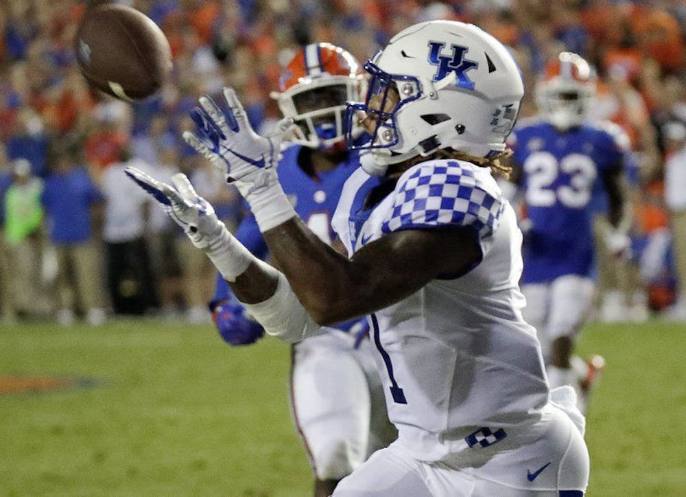 <p>Lynn Bowden caught a 54-yard touchdown from quarterback Terry Wilson late in the third quarter. The Wildcats took a 21-10 advantage over UF, surging to a 27-16 victory in The Swamp.&nbsp;</p>