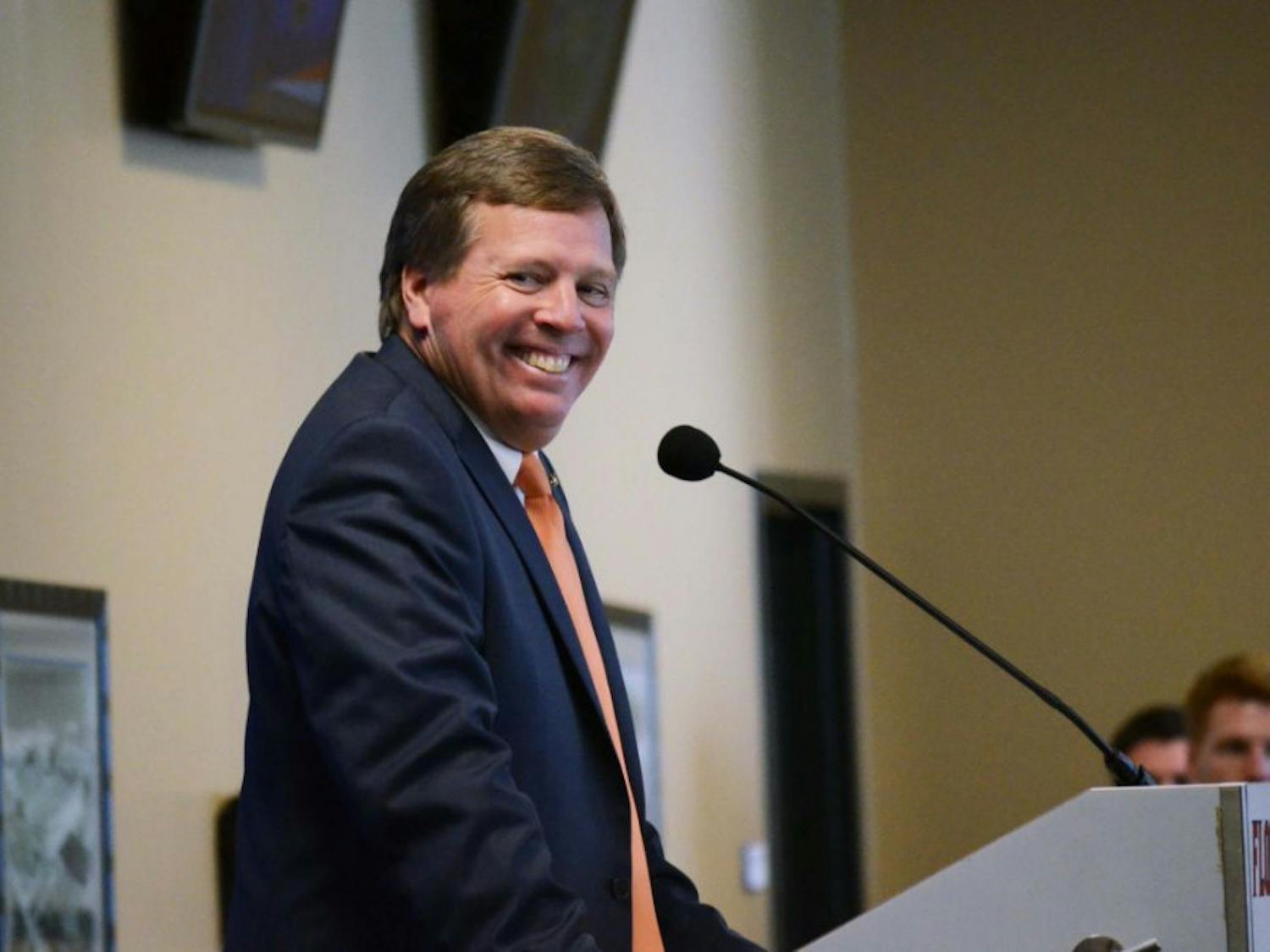 New head football coach Jim McElwain speaks at his introductory press conference in Ben Hill Griffin Stadium.