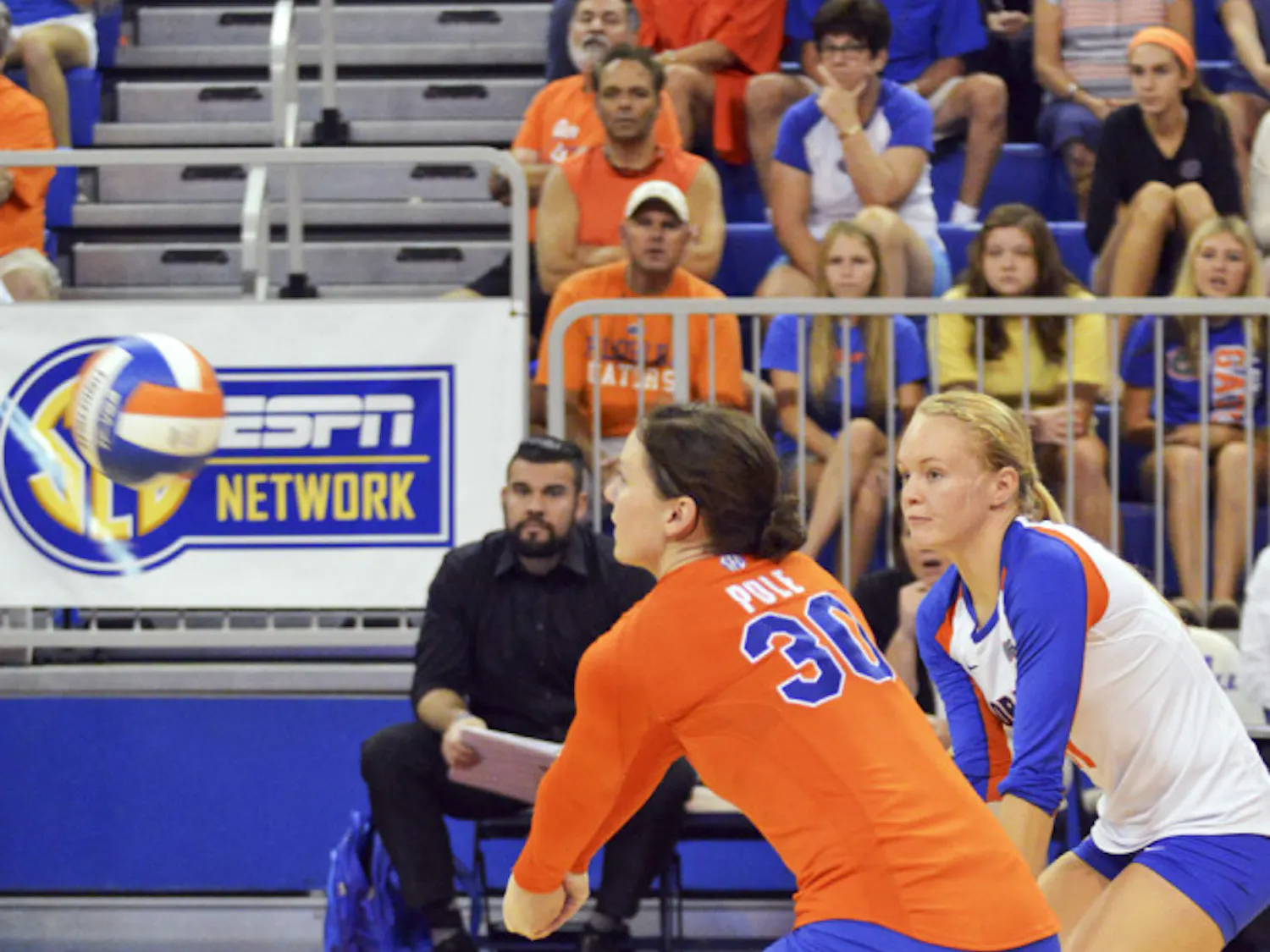 Holly Pole (30) and Maddy Monserez attempt to dig the ball during Florida's 3-0 win against Ole Miss on Sunday in the O'Connell Center.