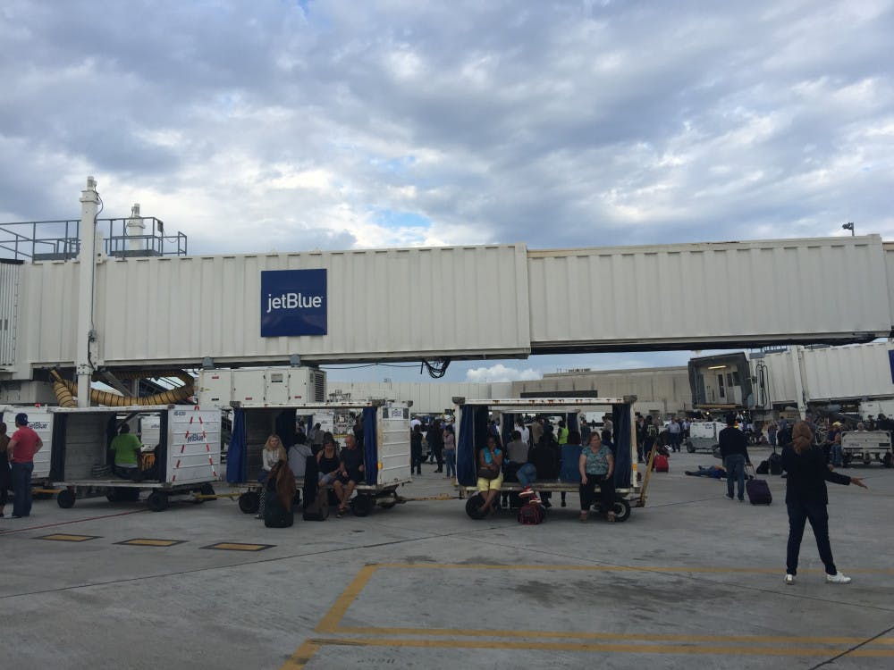 <p>Thousands of would-be passengers stand outside at the Fort Lauderdale-Hollywood International Airport tarmac after being evacuated due to an active shooter in Terminal 2.</p>