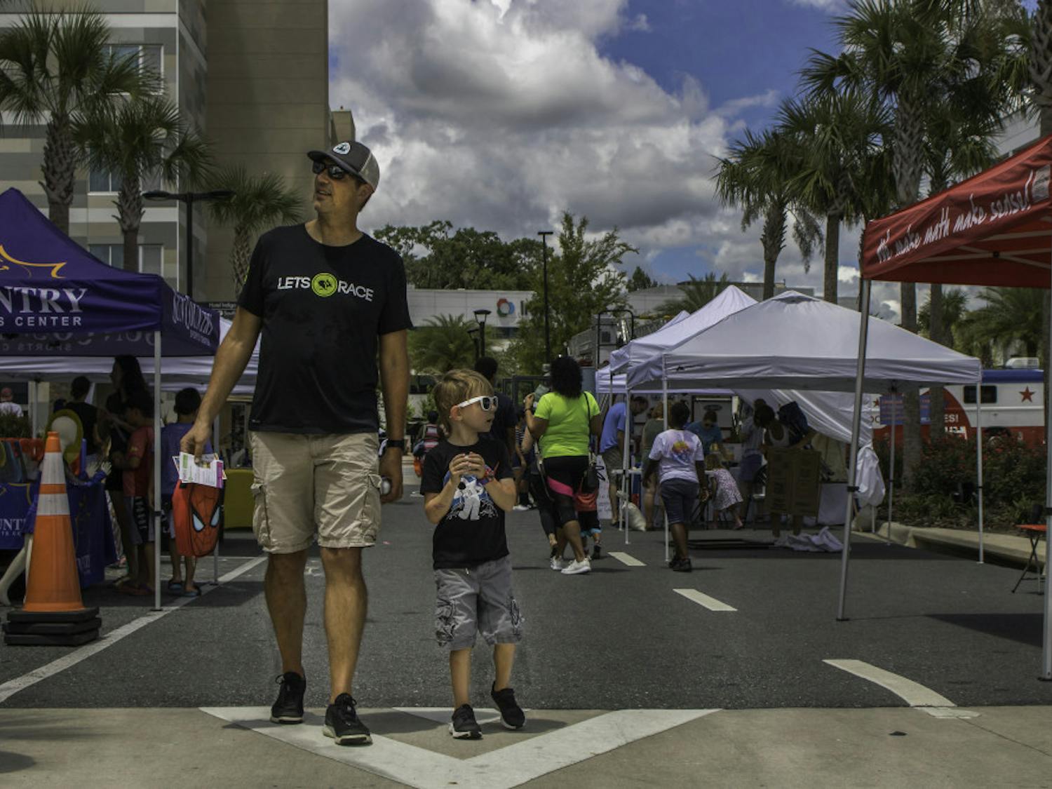 Celebration Pointe was lined with booths and vendors on Saturday as part of a Back to School Bash co-sponsored by Fun 4 Gator Kids, an organization that posts lists of local children’s activities, and the shopping center. The event was created to give children an afternoon of fun activities and a chance to interact with local businesses before Alachua County Schools begin classes on Aug. 12. The event featured fencing and archery demonstrations, charity drives, food and refreshments from vendors and a bounce house.