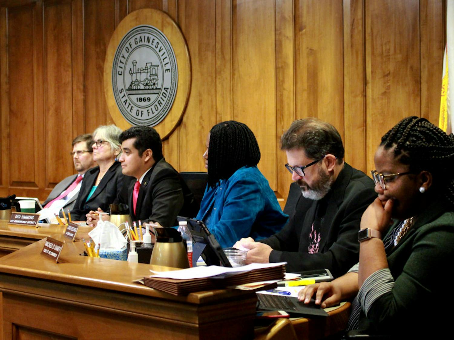 Mayor Lauren Poe, Gainesville city commissioners and city staff listen to the public’s comments Jan. 18, 2019, during the Gainesville City Commission meeting at City Hall. The meeting was over four hours long, and the panel of legislators passed legislation that banned the use of plastic bags in Gainesville.