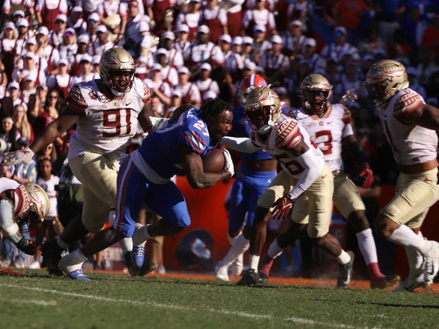 Florida&#x27;s Dameon Pierce runs toward the end zone after losing his helmet during a Nov. 27 game against Florida State. He was drafted in the fourth round by the Houston Texans Saturday.