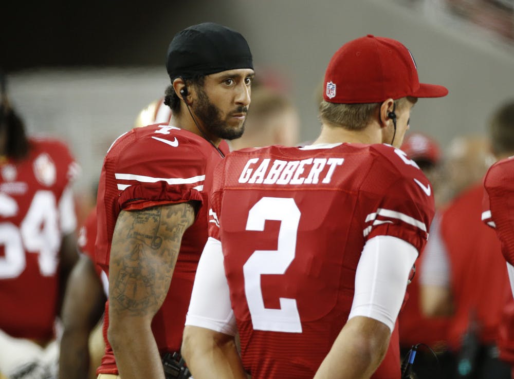 <p>San Francisco 49ers quarterbacks Colin Kaepernick, left, and Blaine Gabbert stand on the sideline during the second half of an NFL preseason football game against the Green Bay Packers on Friday, Aug. 26, 2016, in Santa Clara, Calif. Green Bay won 21-10. (AP Photo/Tony Avelar)</p>