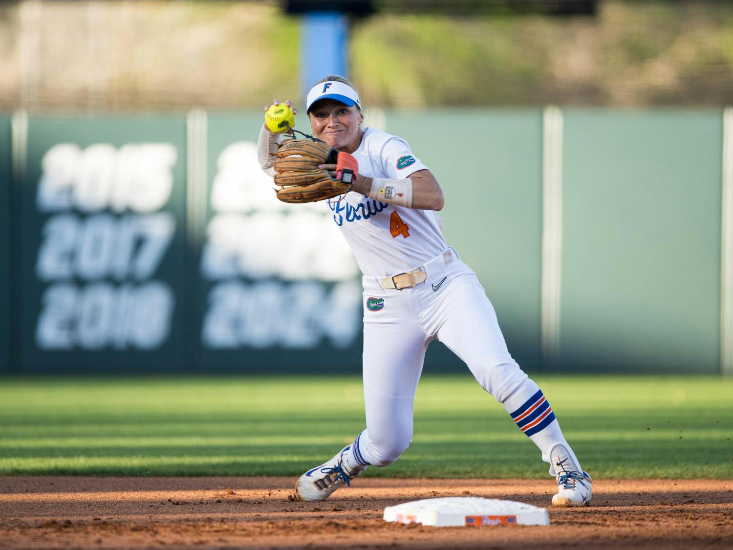 Florida Gators infielder Rylee Holtorf (4) throws the ball in a softball game against UCF in Gainesville, Fla., on Wednesday, March 12, 2025.