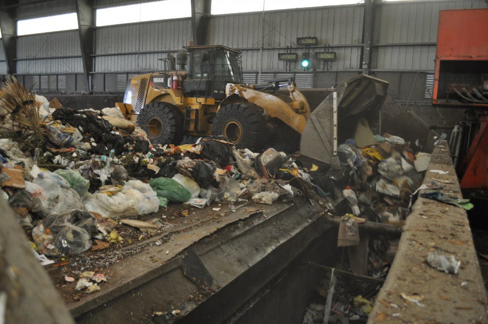 <p>Photo caption: Waste gets pushed into trailers at Leveda Brown Environmental Park and will be transferred to New River landfill in Raiford.</p>