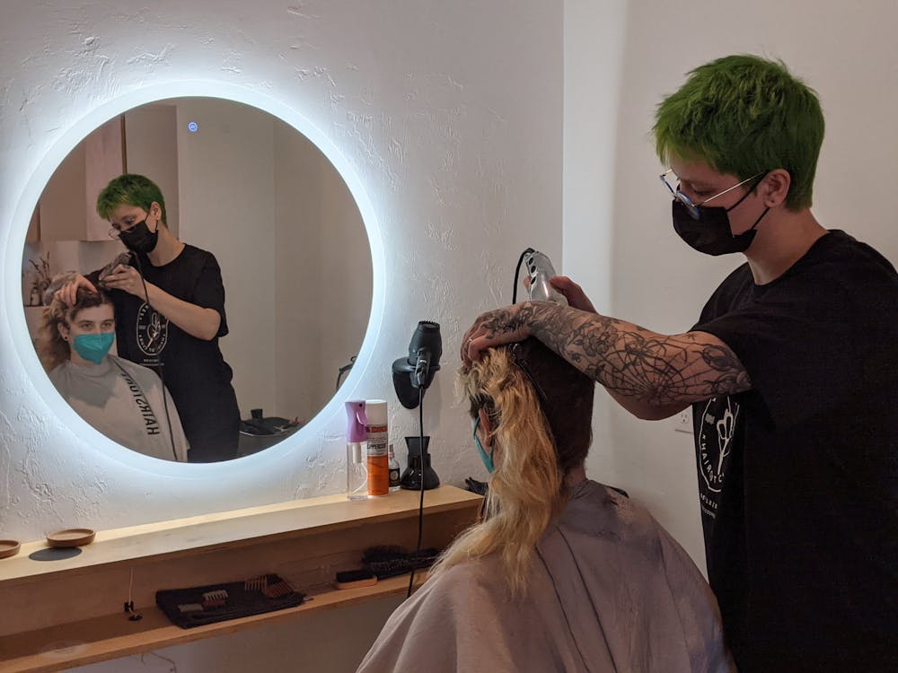 <p>Jamie Devine-Spears gets their haircut at Goldenrod Parlor, an LGBTQ friendly hair salon Sunday, June 12, 2022.</p>