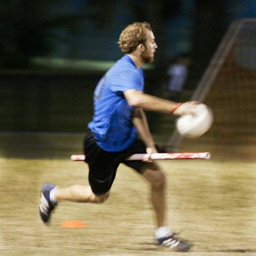 <p>Nick Wright, a 19-year-old criminology sophomore and chaser coach practices on Flavet Field on Sunday night for the upcoming International Quidditch World Cup in New York City.</p>