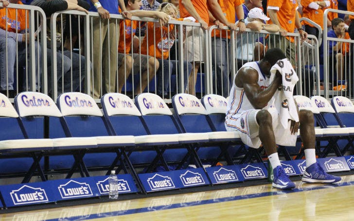 Center Patric Young wipes his brow with a towel during a timeout in Florida’s 83-52 win against Missouri on Jan. 19 in the O’Connell Center.