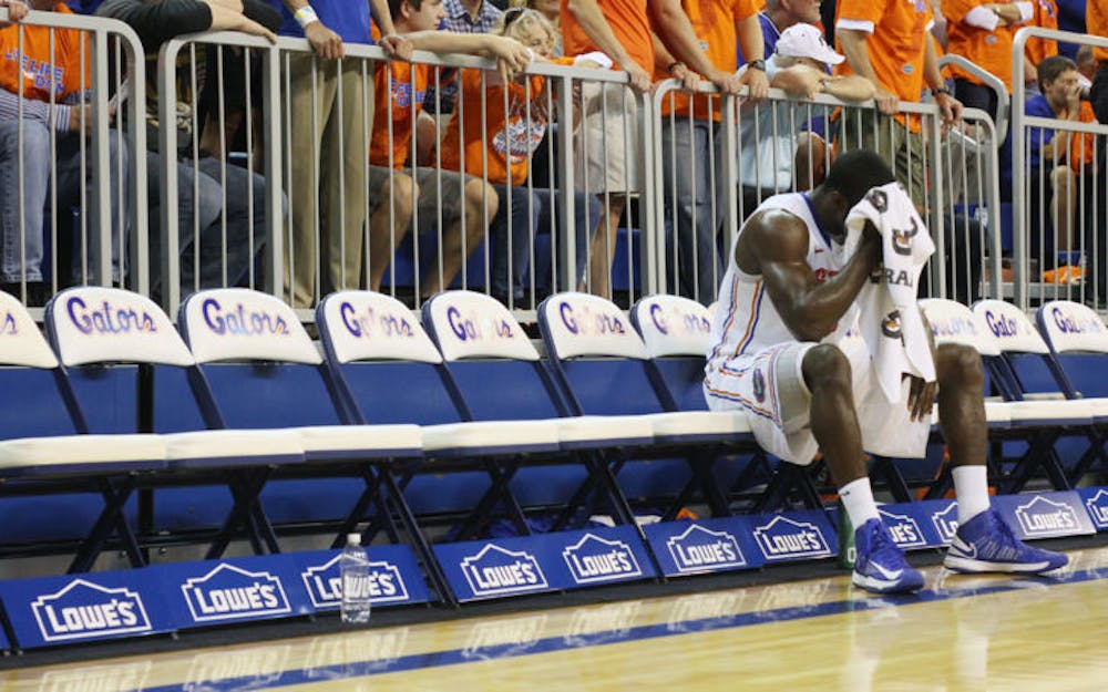 <p>Center Patric Young wipes his brow with a towel during a timeout in Florida’s 83-52 win against Missouri on Jan. 19 in the O’Connell Center.</p>