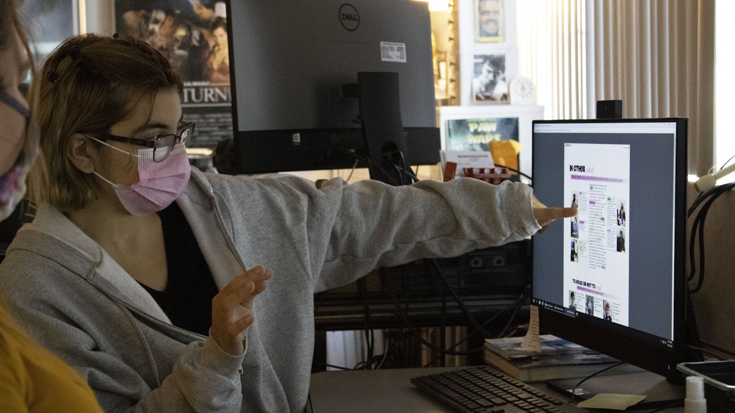Reyhan Kepic, 18, a senior at Gainesville High School and the editor-in-chief of the school’s yearbook points at a computer screen as she explains the layout of a page spread in the GHS yearbook on Monday, April 12, 2021.