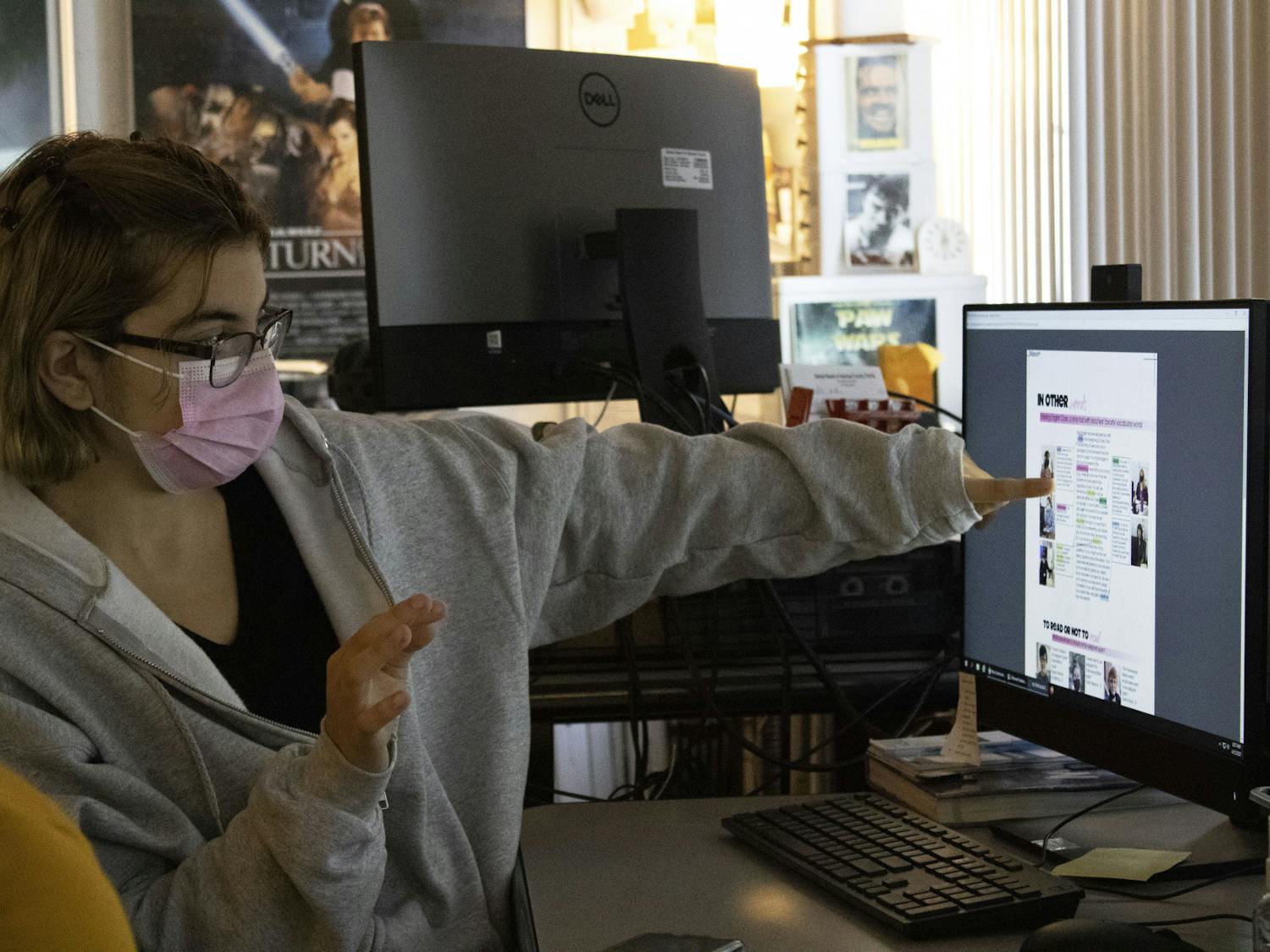 Reyhan Kepic, 18, a senior at Gainesville High School and the editor-in-chief of the school’s yearbook points at a computer screen as she explains the layout of a page spread in the GHS yearbook on Monday, April 12, 2021.