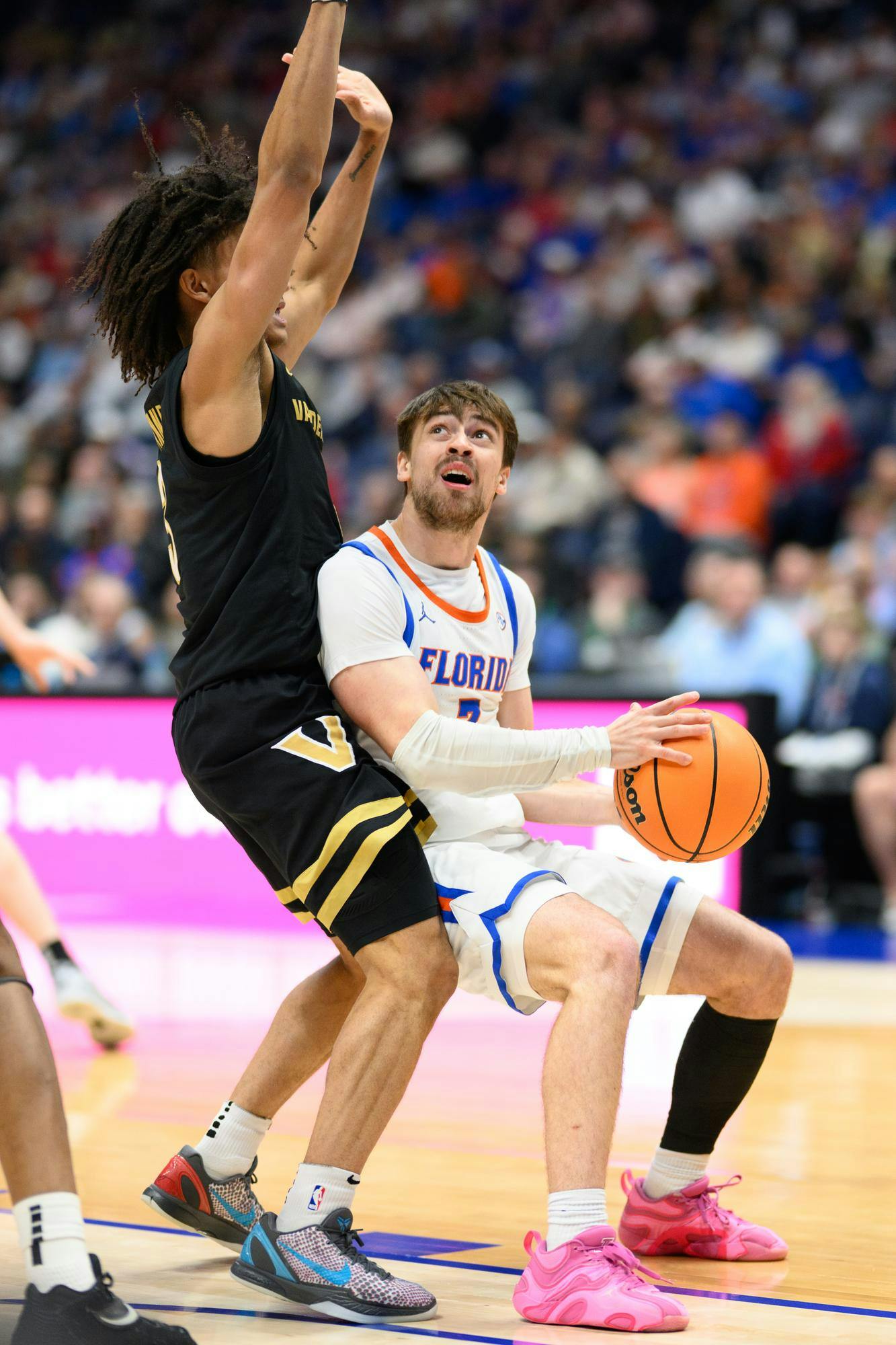 Florida guard Urban Klavzar (7) drives during the first half of an SEC Men's Basketball Tournament semifinal game against Vanderbilt, Saturday, March 14, 2026, in Nashville, Tenn.