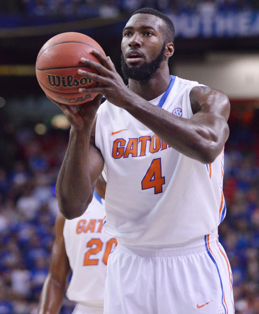 <p align="justify">Patric Young attempts a free throw during Florida’s 61-60 win against Kentucky on Sunday in the Georgia Dome in Atlanta.</p>