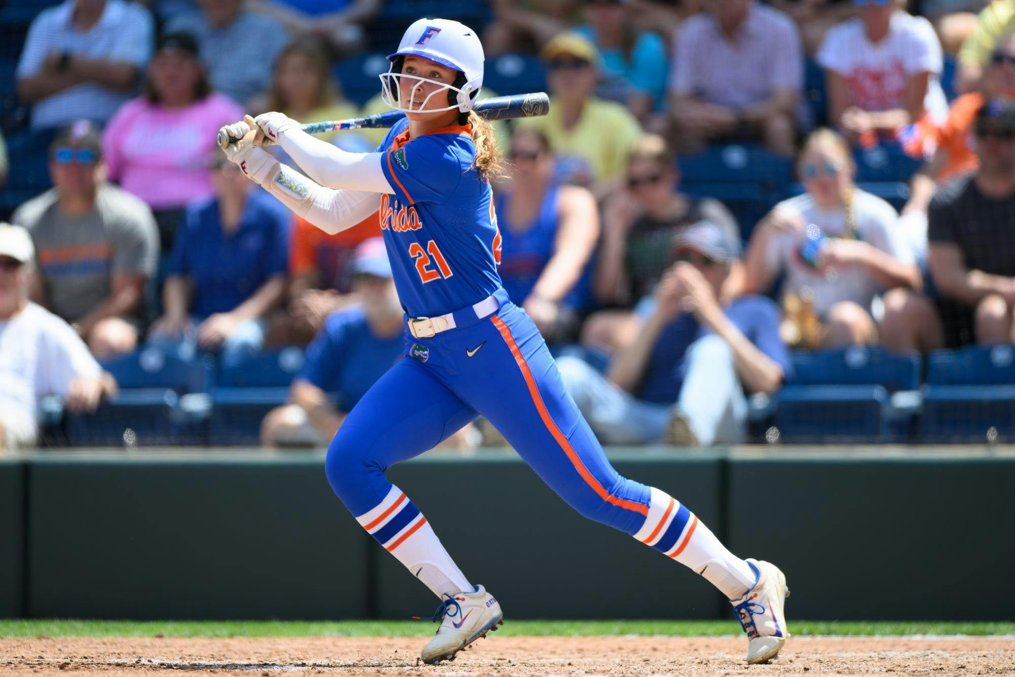 Florida outfielder Taylor Shumaker (21) hits during an NCAA softball game against Mississippi State, Saturday, April 4, 2026, in Gainesville, Fla.