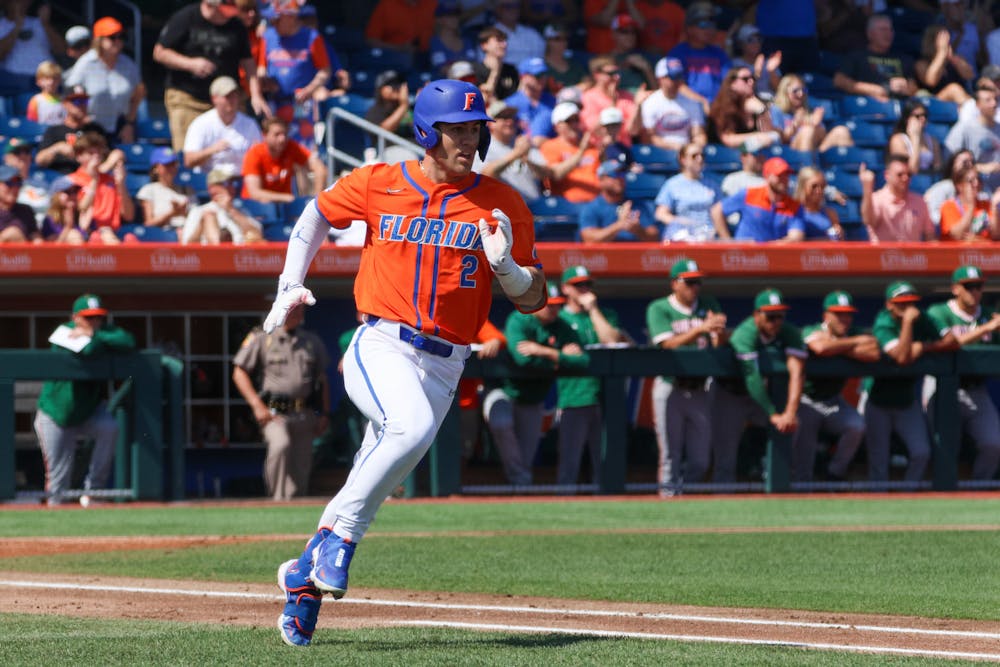 Florida right fielder Ty Evans runs toward first base in the Gators' 14-4 win against the Miami Hurricanes Sunday, March 5, 2023.