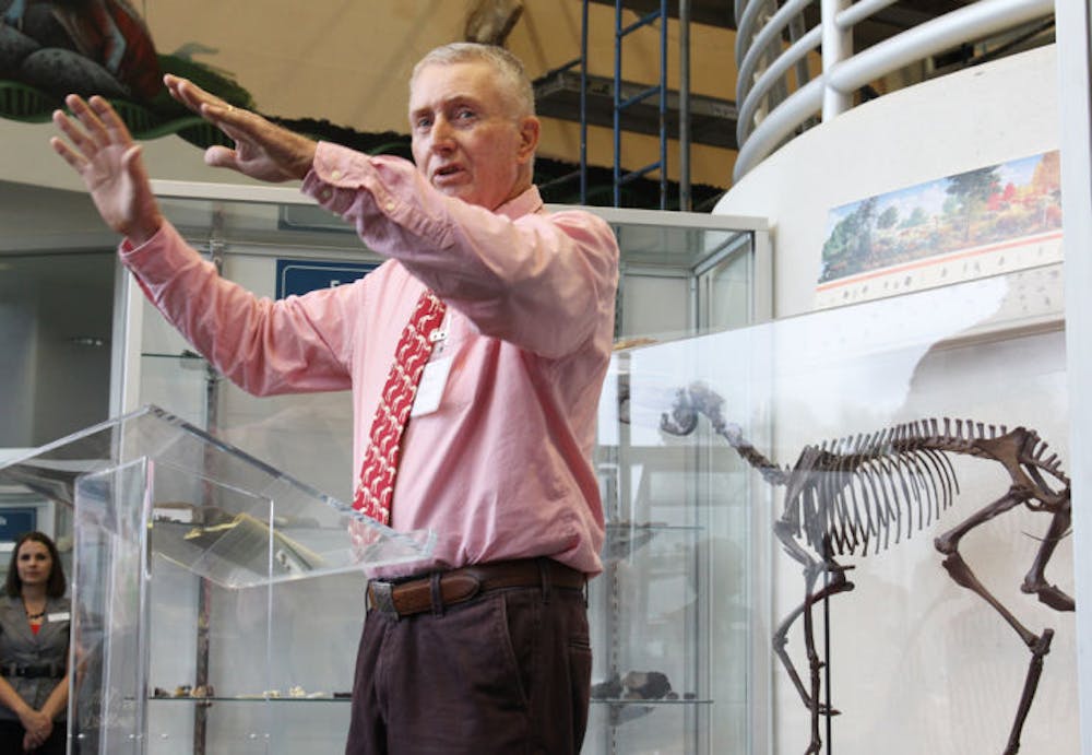 <p>Michael Patrick, natural sciences professor at Santa Fe College, explains to attendees that the new geological exhibit is more than the department could have ever expected.</p>