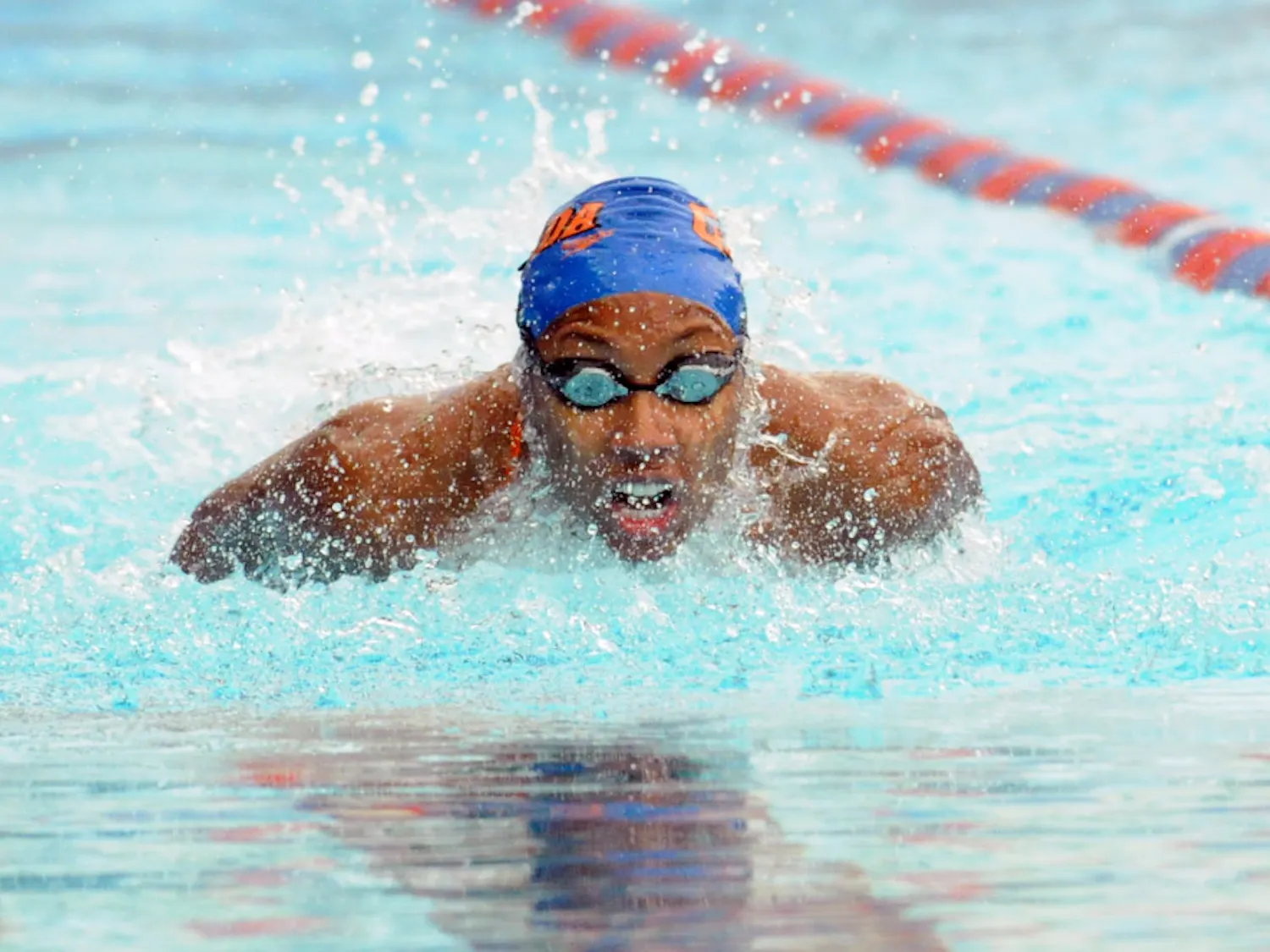 Natalie Hinds races in the 100 meter butterfly during Florida’s meet against Auburn on Jan. 23, 2016, in the O’Connell Center.