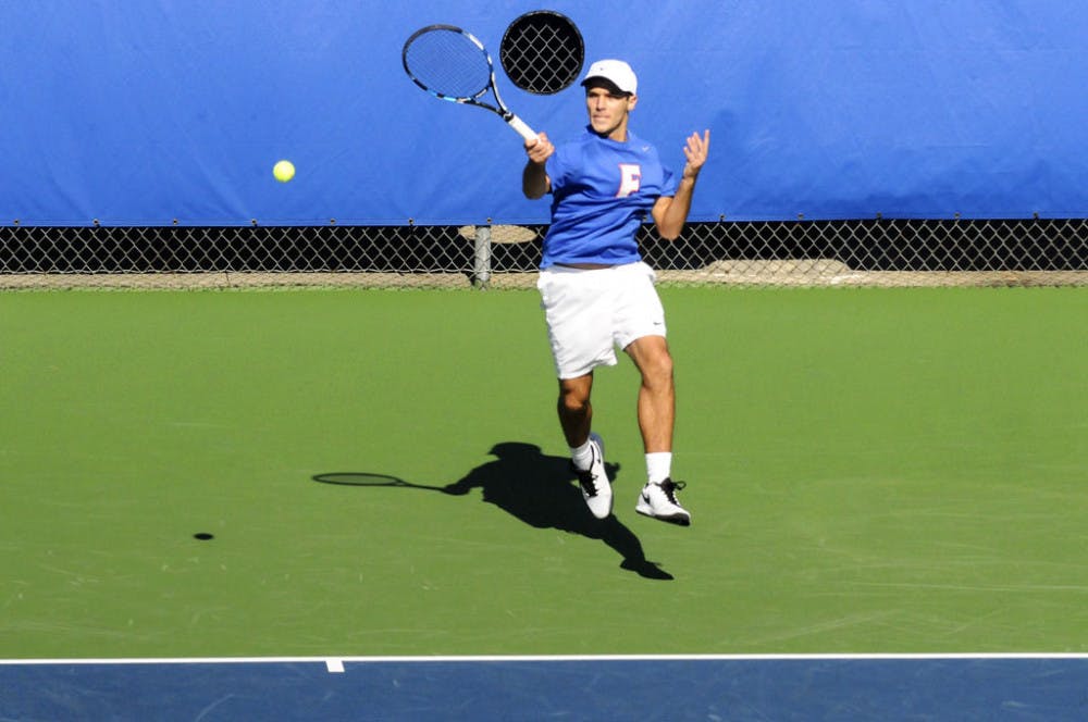 <p>Chase Perez-Blanco returns a ball during Florida's win against Troy on Jan. 17, 2016, at the Ring Tennis Complex.</p>