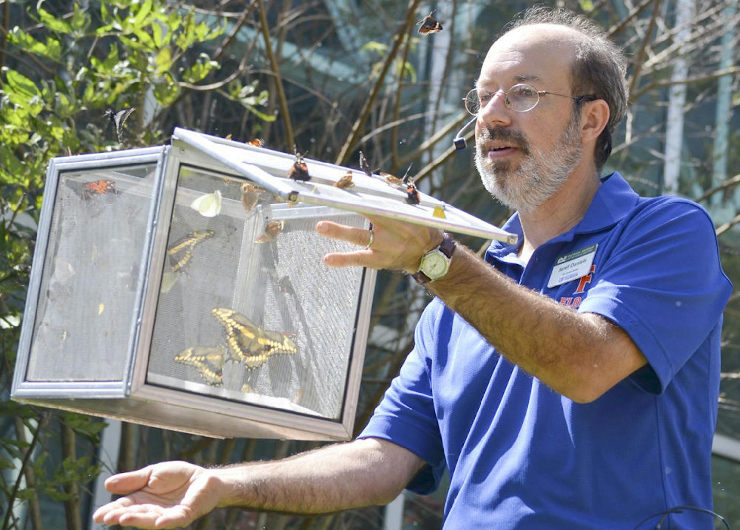Jaret C. Daniels, a curator at the McGuire Center for Lepidoptera and Biodiversity, released native Florida butterflies during Saturday’s ButterflyFest event at the Florida Museum of Natural History.