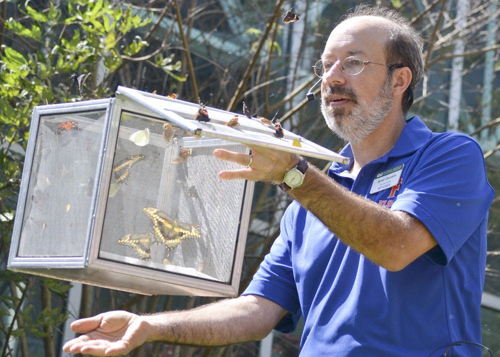 <p class="p1">Jaret C. Daniels, a curator at the McGuire Center for Lepidoptera and Biodiversity, released native Florida butterflies during Saturday’s ButterflyFest event at the Florida Museum of Natural History.</p>