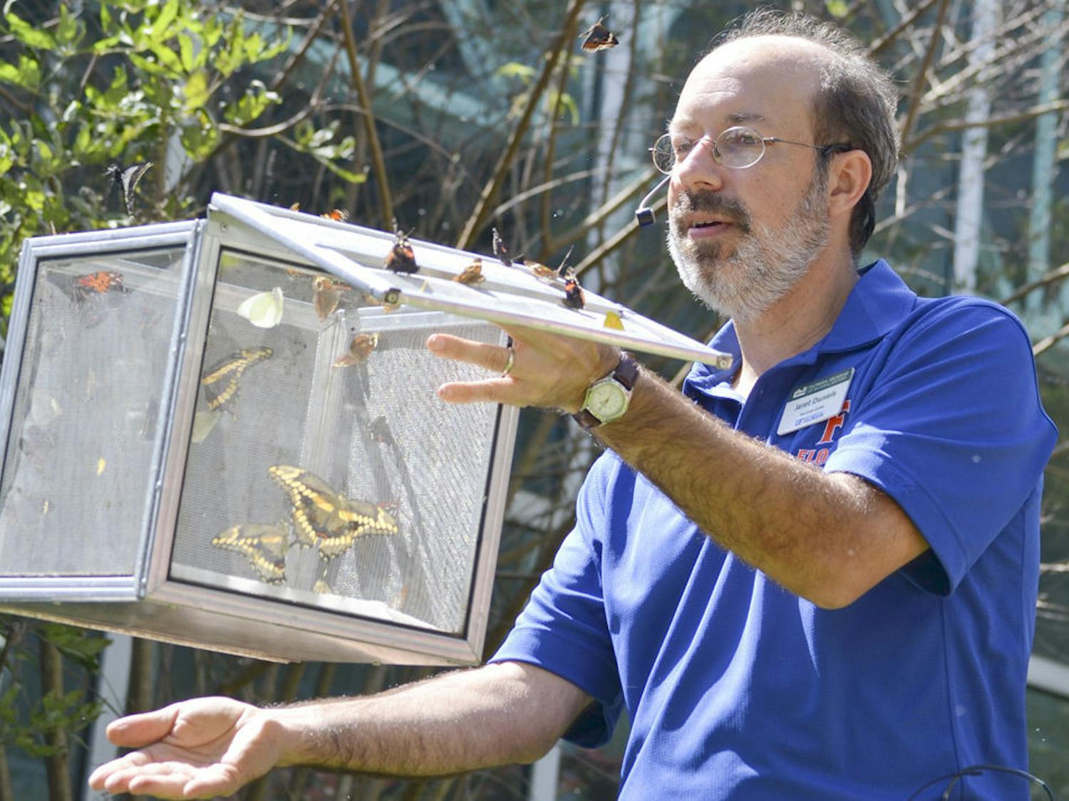 Jaret C. Daniels, a curator at the McGuire Center for Lepidoptera and Biodiversity, released native Florida butterflies during Saturday’s ButterflyFest event at the Florida Museum of Natural History.