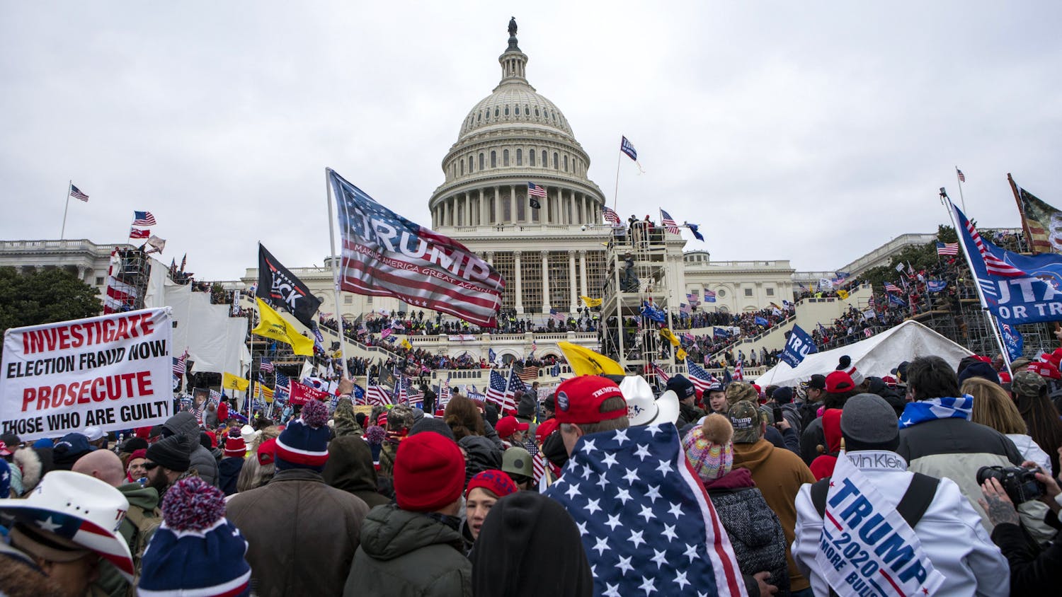 Rioters loyal to President Donald Trump rally at the U.S. Capitol in Washington on Jan. 6, 2021. Law enforcement officials say, Taylor Taranto, a man wanted for crimes related to the Jan. 6, 2021, insurrection at the U.S. Capitol has been arrested in the Washington neighborhood where former President Barack Obama lives. Taranto was seen a few blocks from the former president's home, and he fled even though he was chased by U.S. Secret Service agents. (AP Photo/Jose Luis Magana, File)