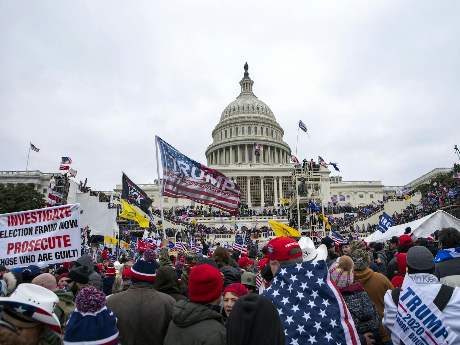 Rioters loyal to President Donald Trump rally at the U.S. Capitol in Washington on Jan. 6, 2021. Law enforcement officials say, Taylor Taranto, a man wanted for crimes related to the Jan. 6, 2021, insurrection at the U.S. Capitol has been arrested in the Washington neighborhood where former President Barack Obama lives. Taranto was seen a few blocks from the former president's home, and he fled even though he was chased by U.S. Secret Service agents. (AP Photo/Jose Luis Magana, File)