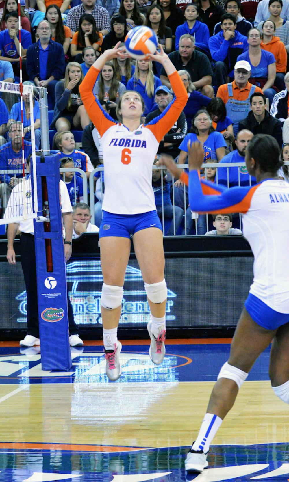 <p>Mackenzie Dagostino sets the ball during Florida's 3-0 win against Alabama on Friday in the O'Connell Center.</p>